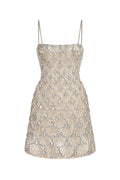 Le Thanh Hoa seashell silver beaded mini dress with intricate detailing, perfect for stylish summer occasions.