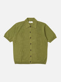The Olive Cotton Lace Knit Jonny Knit Shirt is shown as a flat lay against a white background. The shirt features a spread collar, a three-button placket, and a distinct openwork square pattern throughout the olive green fabric.