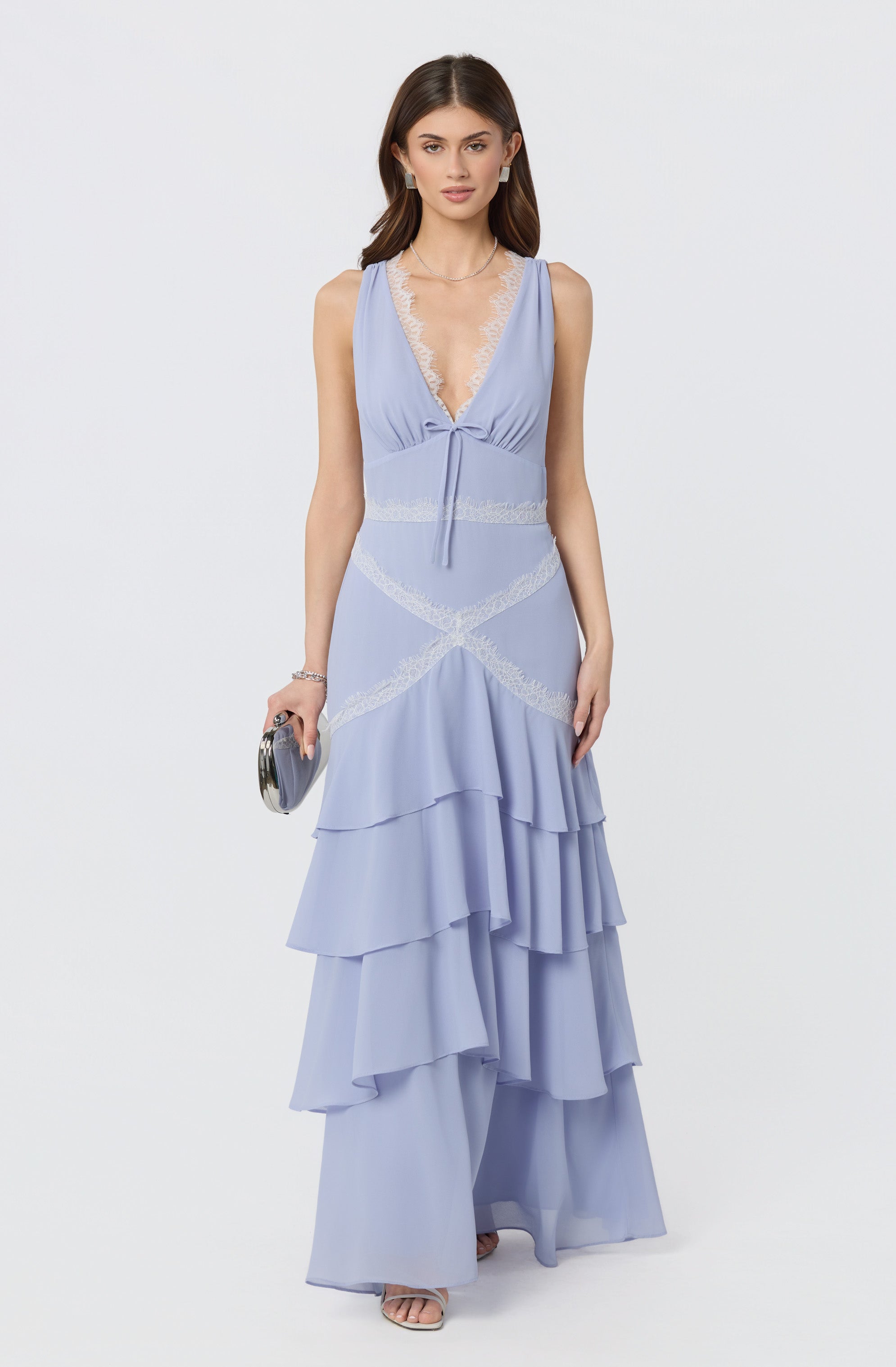 Women’s light blue sleeveless dress with lace details and tiered ruffled skirt.