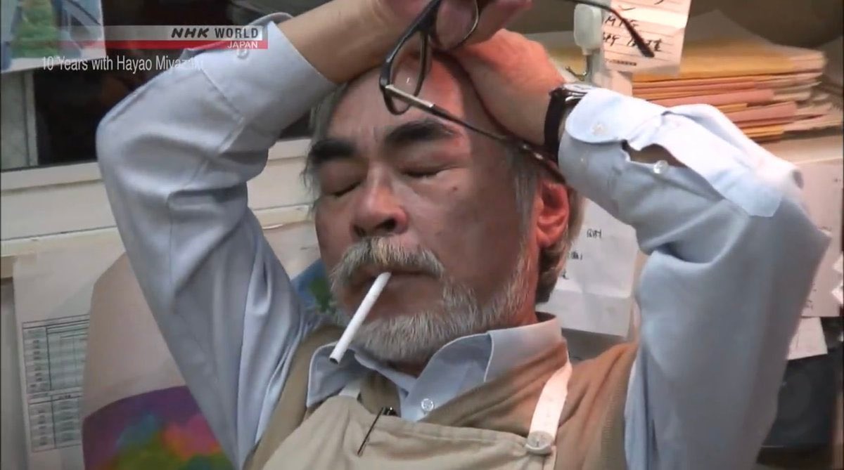 hayao miyazaki smoking hands on head tired thinking
