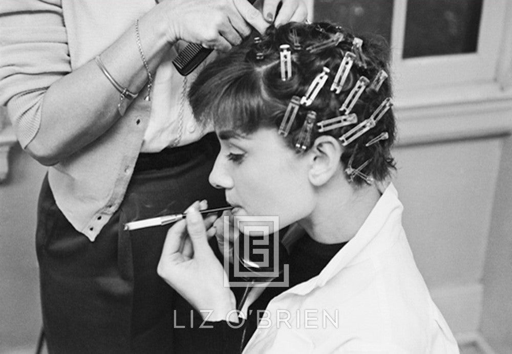 Audrey Hepburn with Curlers, Smoking, 1953 by Mark Shaw