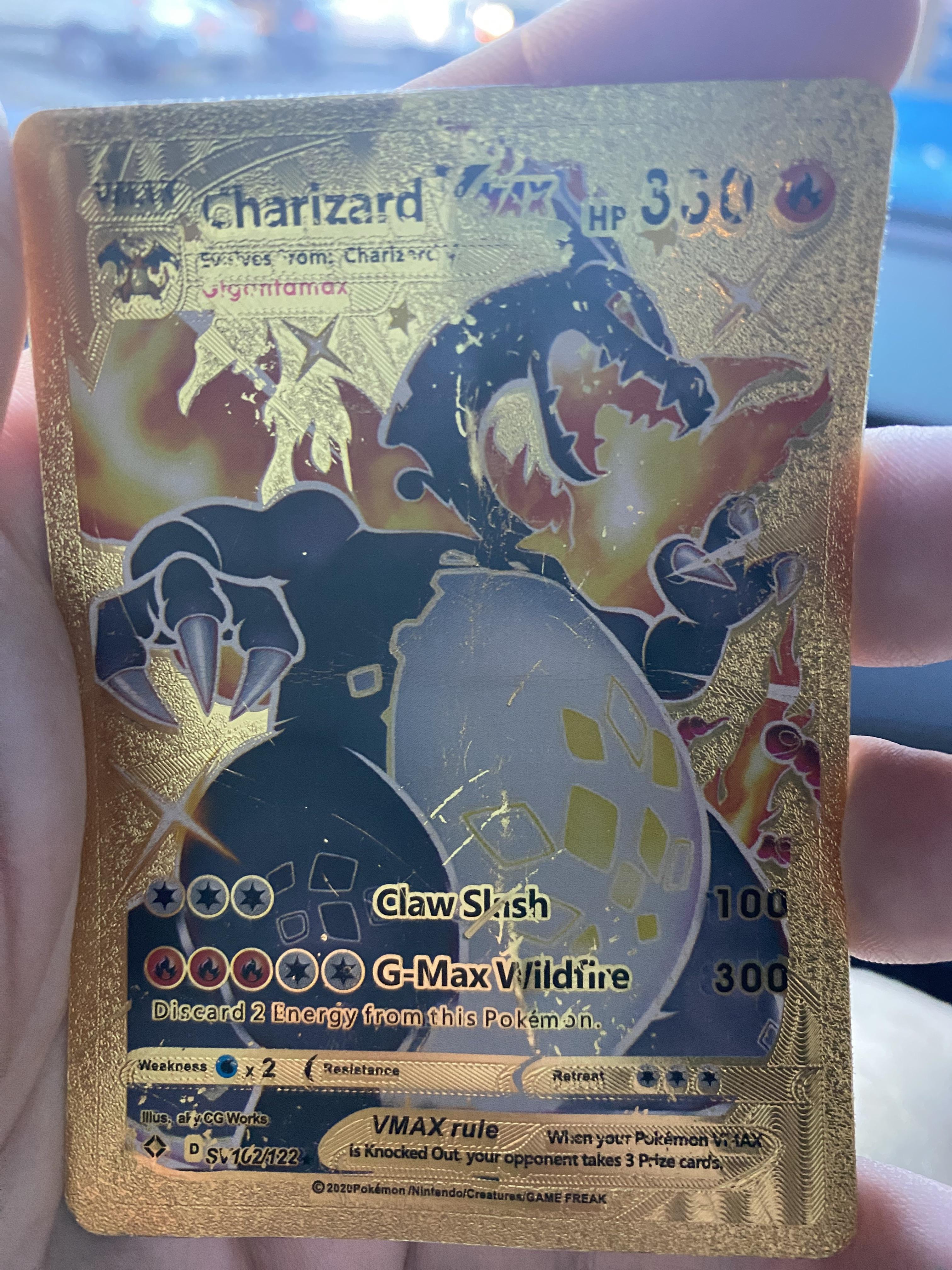 Real or fake? Shiny gold foil vmax charizard. : r/IsMyPokemonCardFake